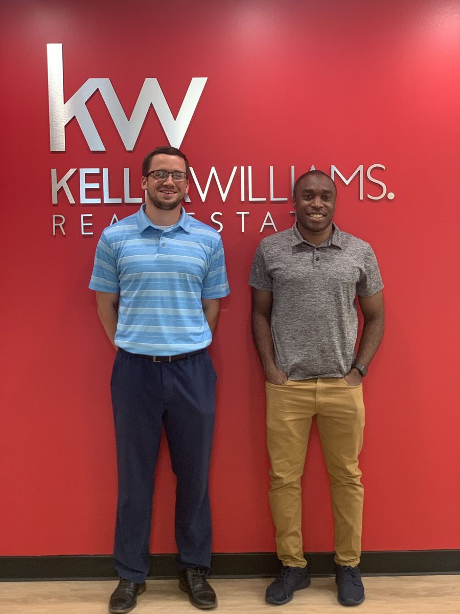 Kyle Keenan with clients on closing day 2